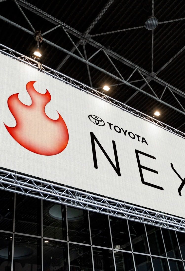 Large outdoor banner containing Toyota Next logo